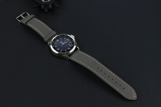 Grey Epsom Leather Watch Strap in a display with a watch