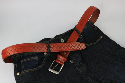 a brown belt on a blue jeans