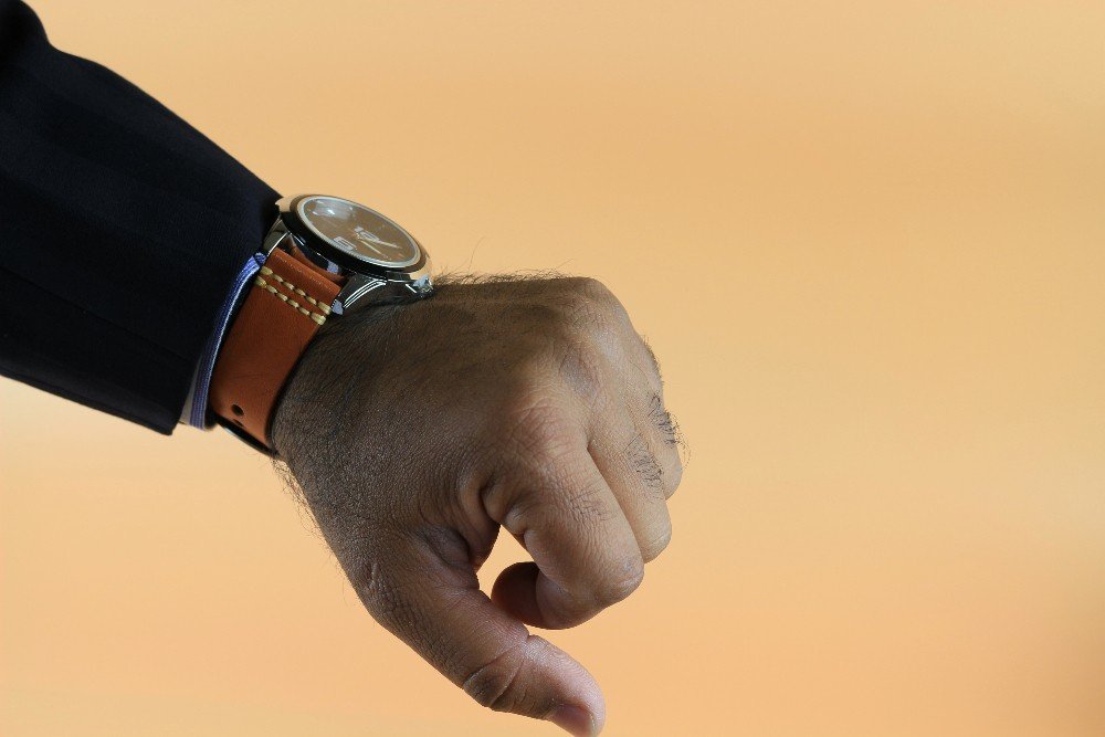 The best among watch straps australia , a man is wearing a watch with genuine leather strap