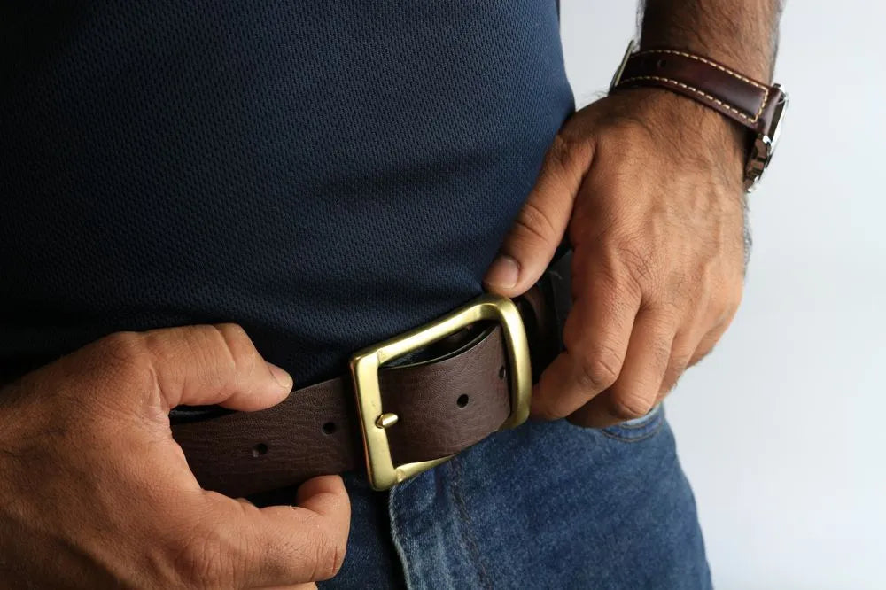 a man wearing a leather belt