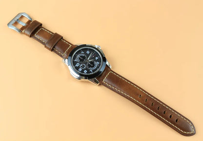Brown Waxed Leather Watch Strap in a display with a watch