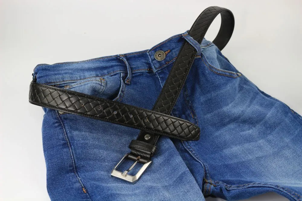 a pair of blue jeans with a black belt