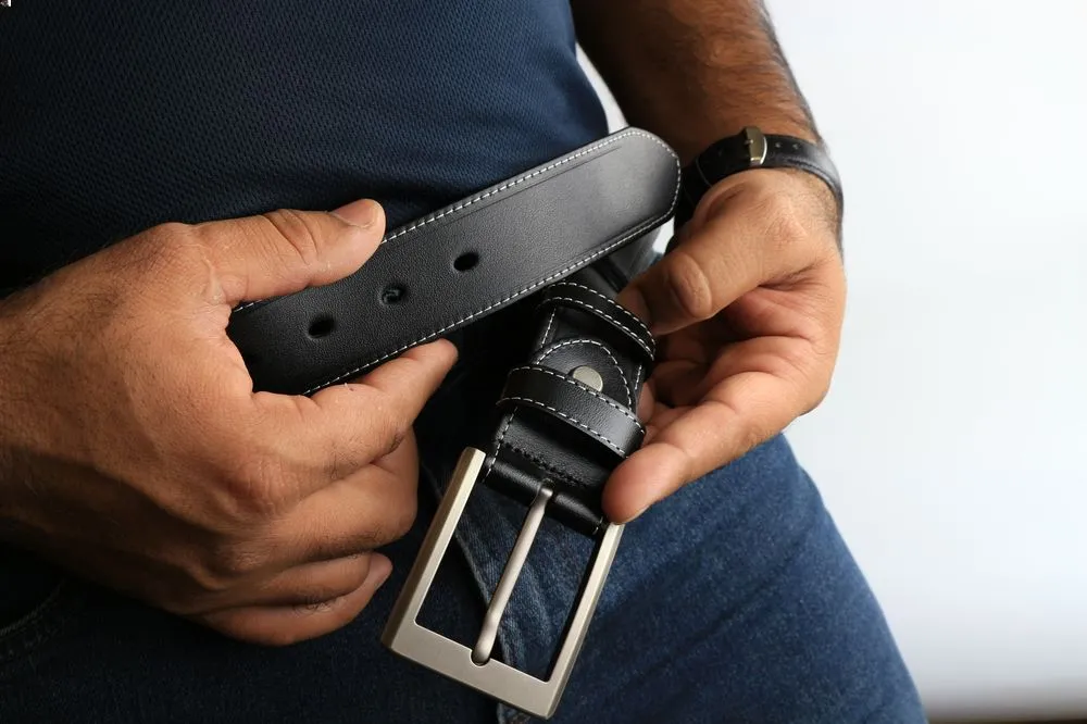 a person holding a belt