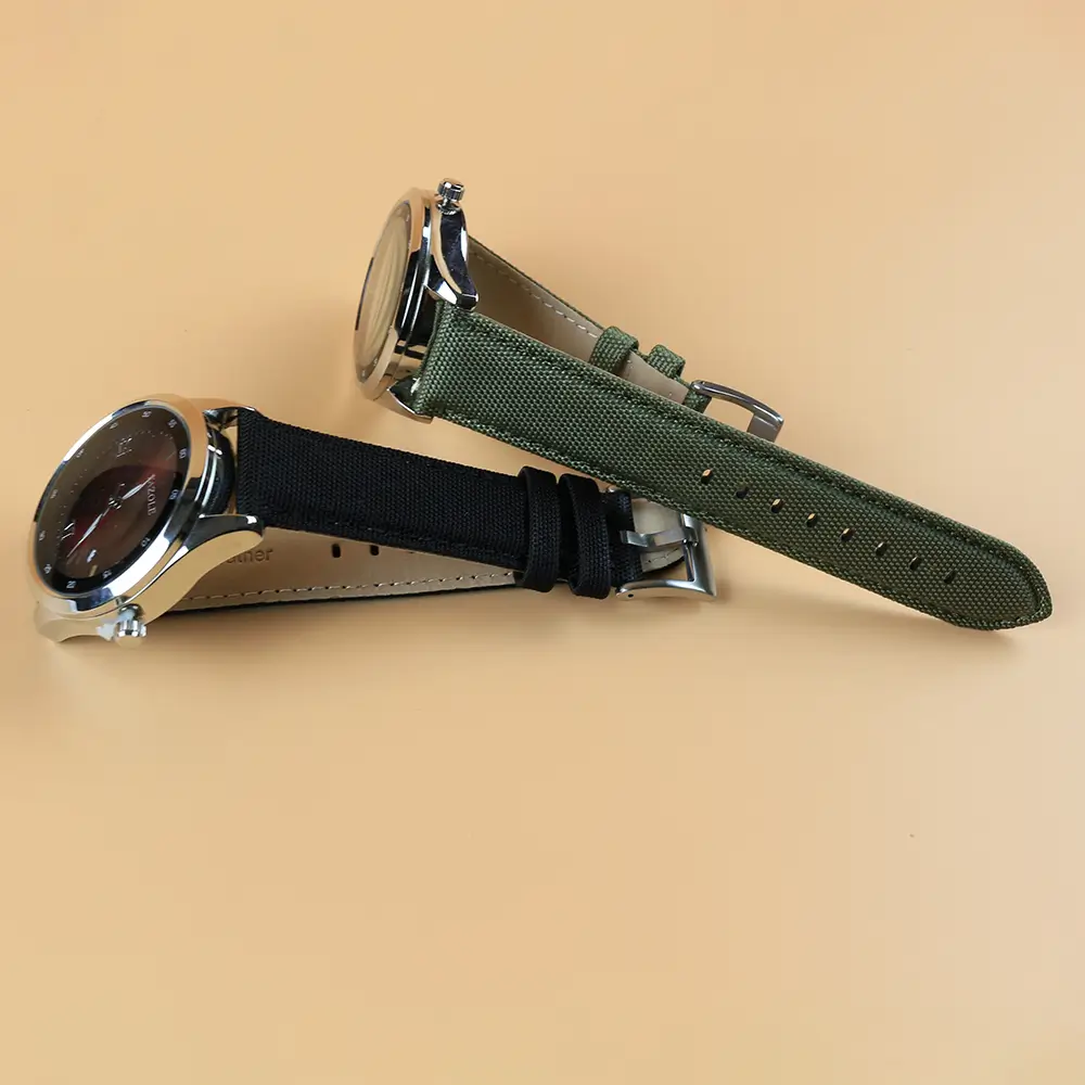 Black And Green Watch Straps Attatched to Dials